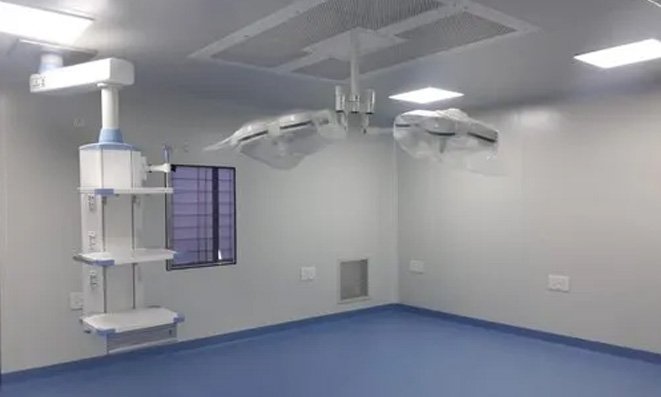 Modular operation theatre with seamless wall panels, surgical lights and pendant