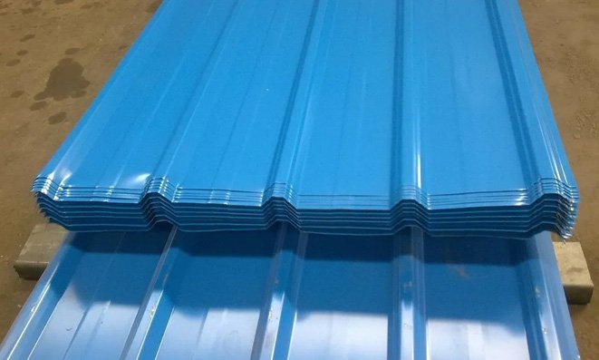 Stack of blue colour-coated trapezoidal metal roofing sheets